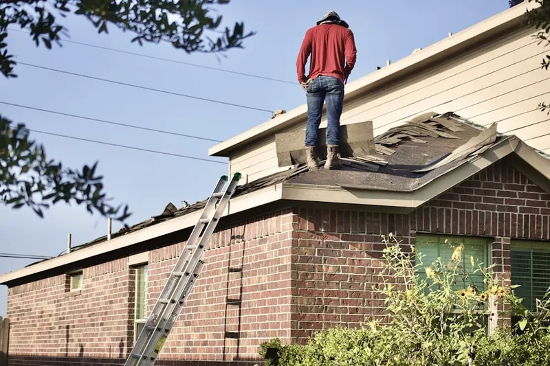 Professional roofer working on a residential roof in Mountain View